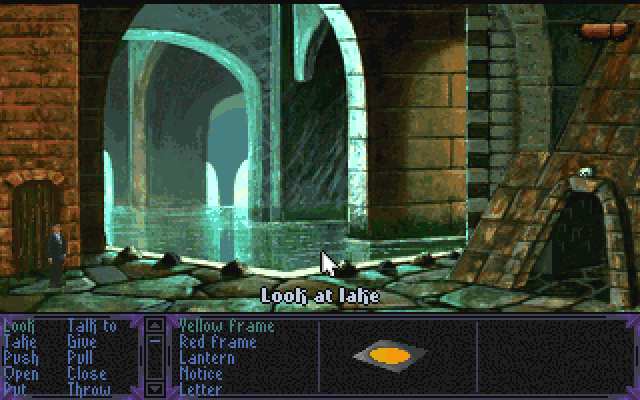 Dungeon scene with a lake. Text overlay reads, Look at lake. Menus list options, including: Look, Take, Push, Open, Put, Talk to, Give, Pull, Close, Throw, Yellow frame, Red frame, Lantern, notice, letter.