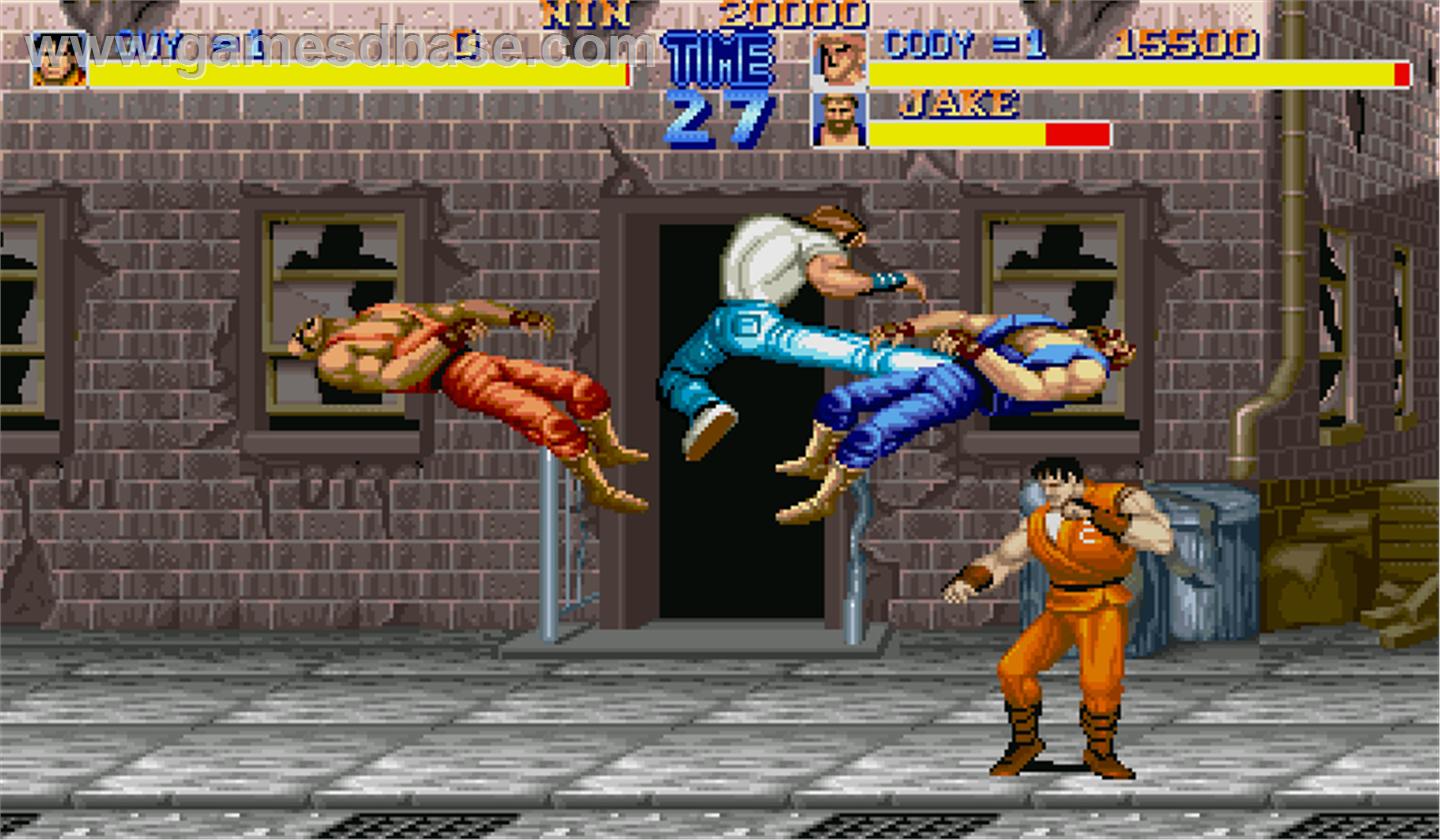 A masculine figure leaps into the air, kicking three other masculine figures on a street. A game overlay shows health bars, portraits, and time remaining.